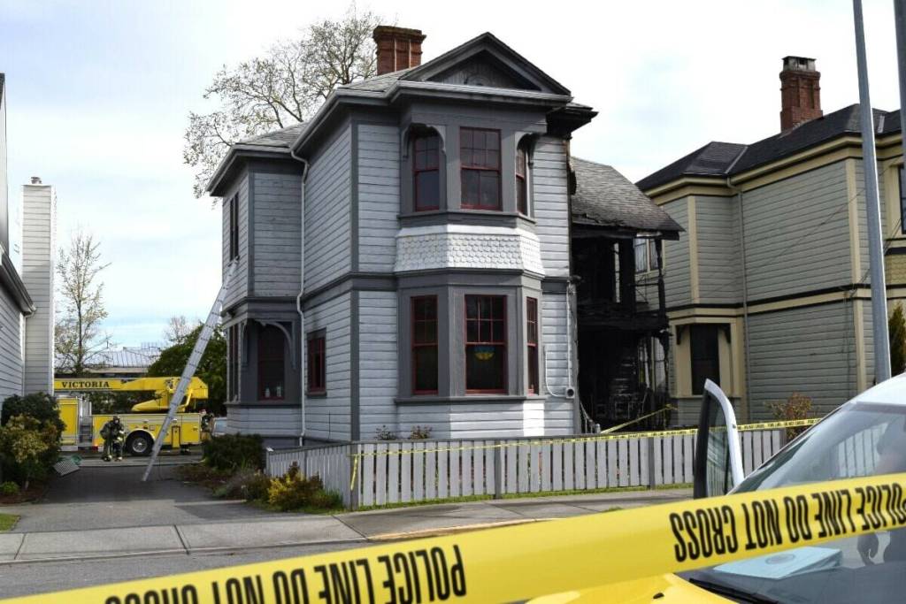 A heritage home on Caledonia was damaged beyond repair after an arson fire in April 2022. The city anticipates allowing the adjacent church, which owns the house, to demolish it as part of a development proposal. (Kiernan Green/Victoria News file)