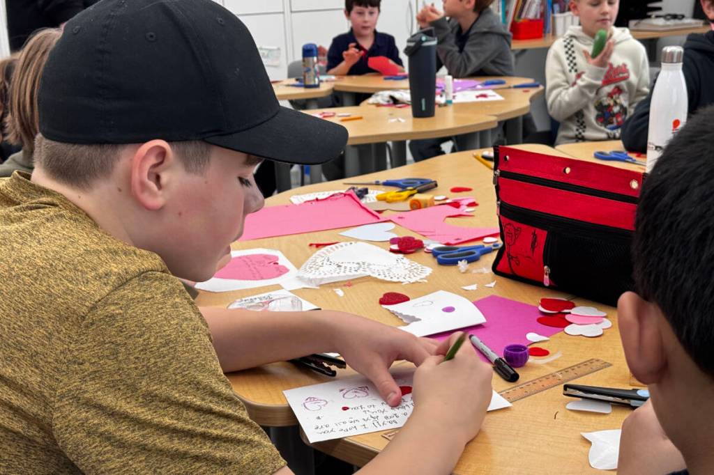Hudson from Centre Mountain Lellum Middle School work together to create handmade valentine&rsquo;s cards on Feb. 5. (Nikhil Nikhil/Goldstream Gazette)